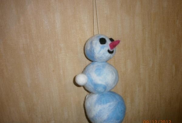 Snowman made of wool using the felting method