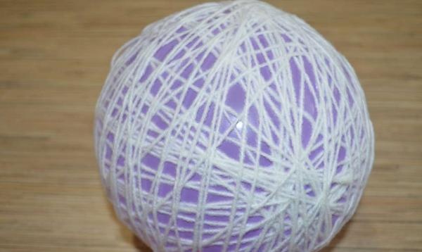 Wrap the ball with thread