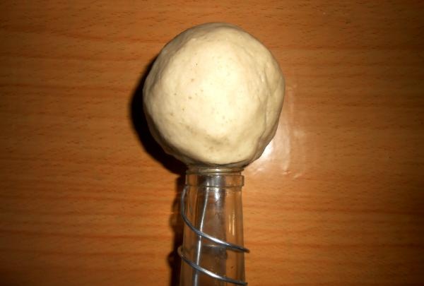 coat the bottle with dough