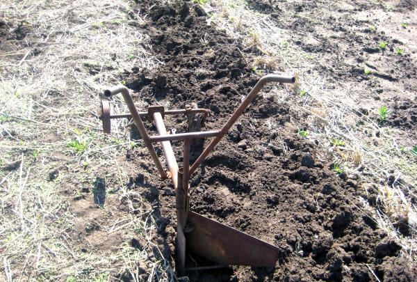 Homemade plow for plowing the land