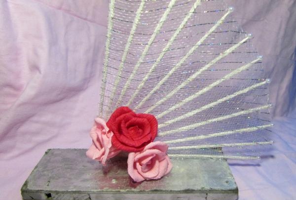 fans with roses made of corrugated paper