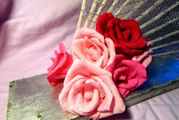 fans with roses made of corrugated paper