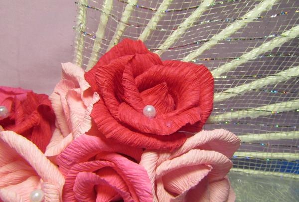 fans with roses made of corrugated paper