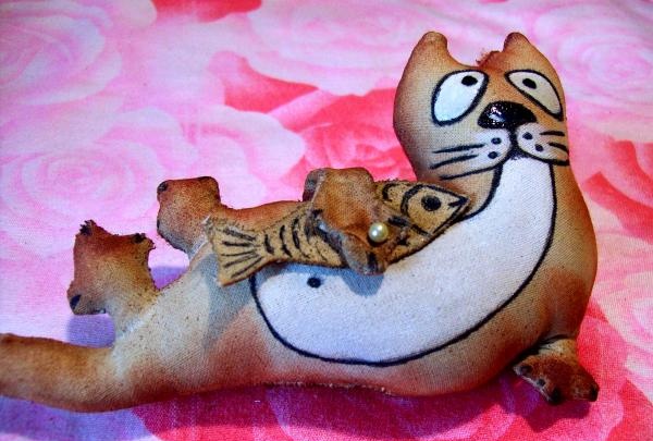 coffee toy cat fisherman