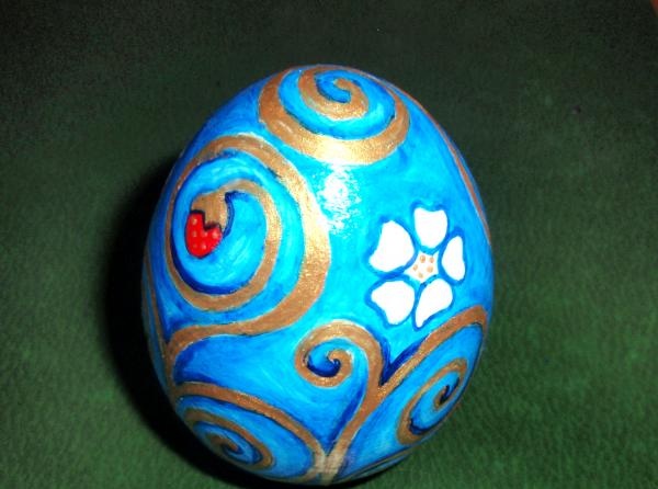 Painting a wooden egg