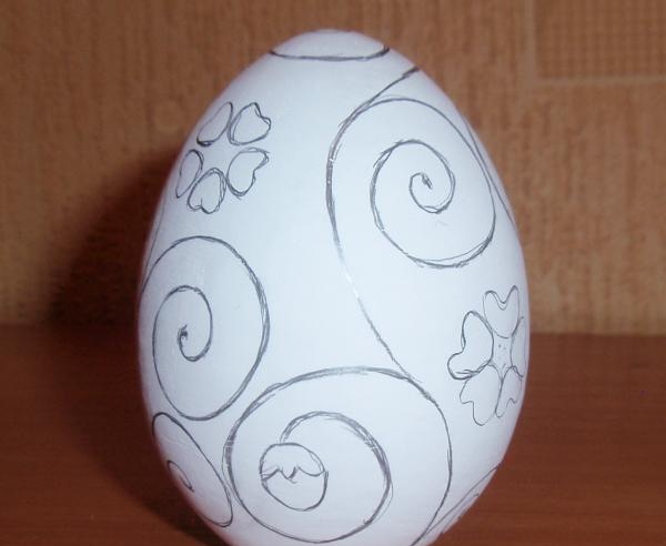 Painting a wooden egg