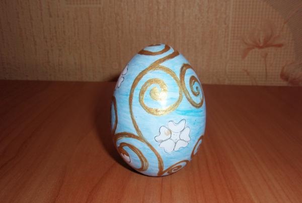 Painting a wooden egg