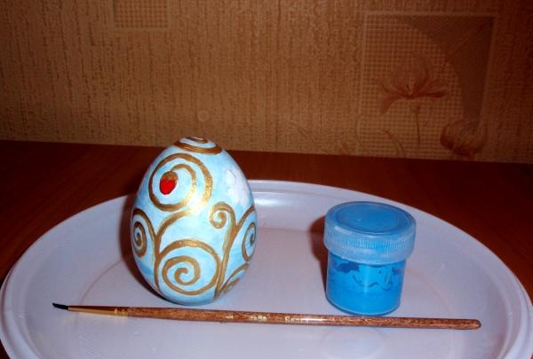 Painting a wooden egg