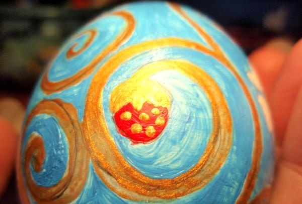 Painting a wooden egg