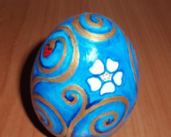 Painting a wooden egg