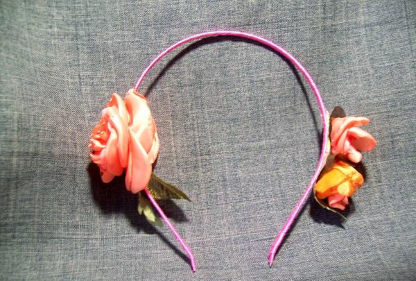 brooch with a headband with silk flowers