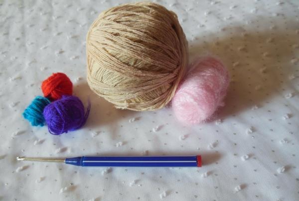 Crochet pincushion in the shape of a donut