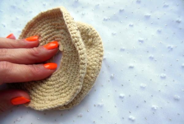 Crochet pincushion in the shape of a donut