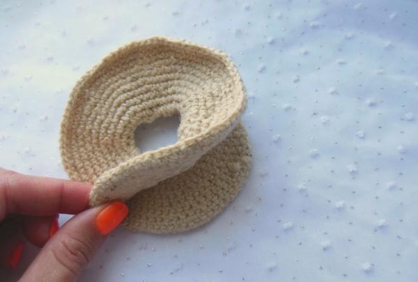 Crochet pincushion in the shape of a donut