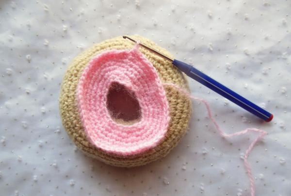 Crochet pincushion in the shape of a donut