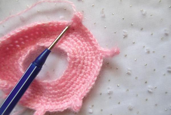 Crochet pincushion in the shape of a donut