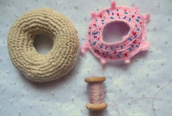 Crochet pincushion in the shape of a donut