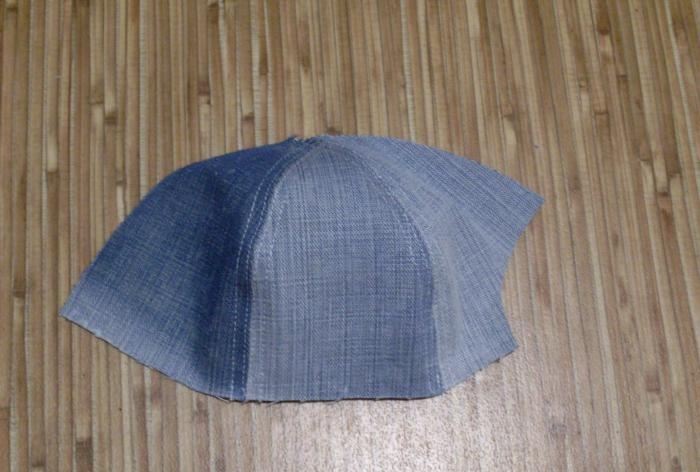 We sew a denim baseball cap for a baby