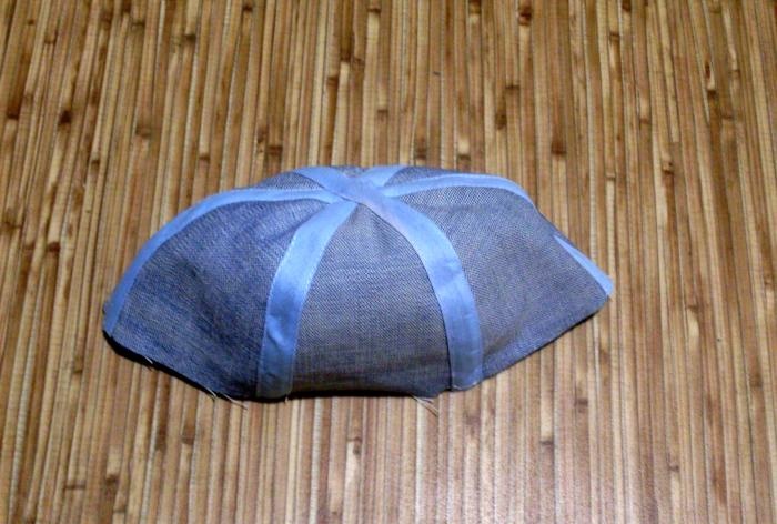 We sew a denim baseball cap for a baby