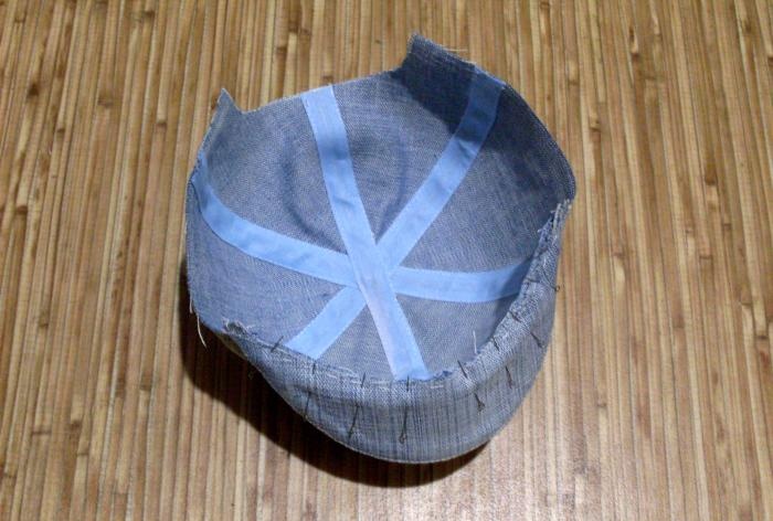 We sew a denim baseball cap for a baby