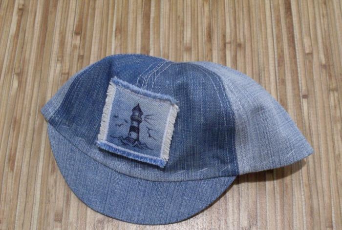 We sew a denim baseball cap for a baby