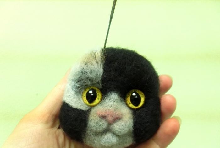 spotted cat made of wool felting