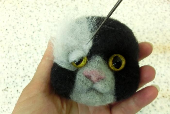 spotted cat made of wool felting