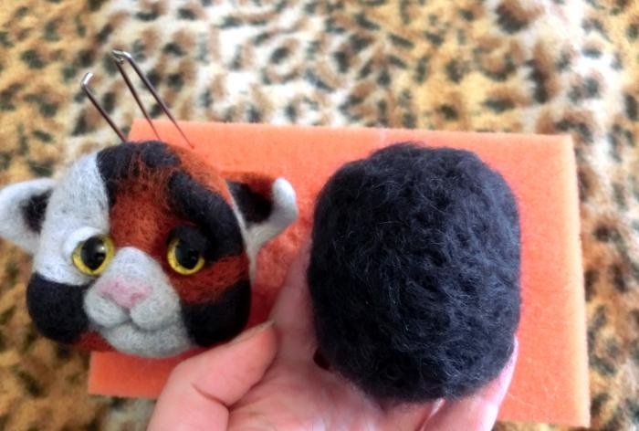 spotted cat made of wool felting