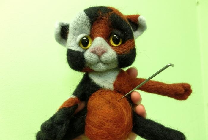 spotted cat made of wool felting