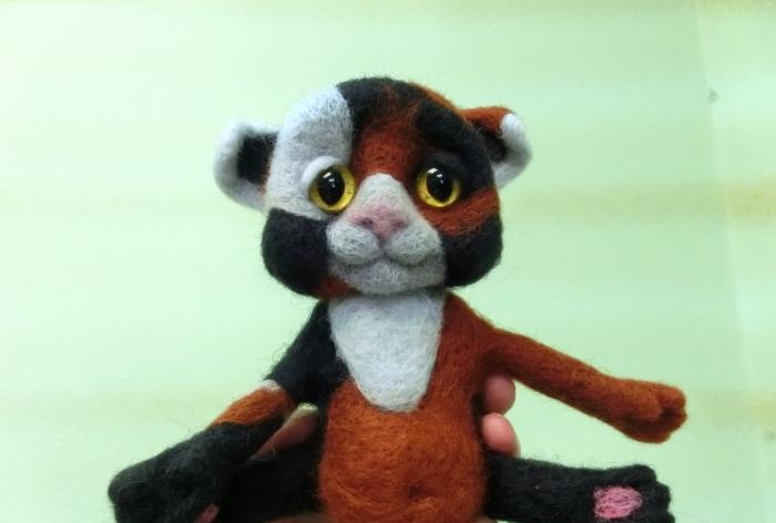 spotted cat made of wool felting