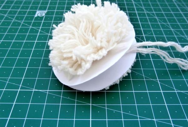 Trim the pompom with scissors