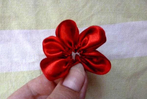 we pull the ribbon into a flower