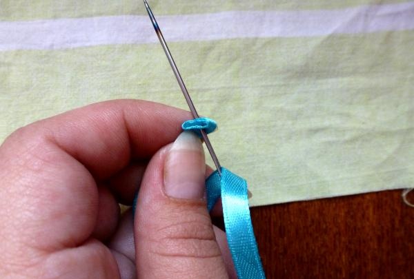 a thin ribbon is threaded through