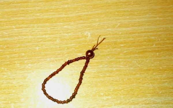 string beads or seed beads onto a thread