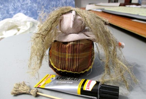 The hair was sewn with threads to the top of the head