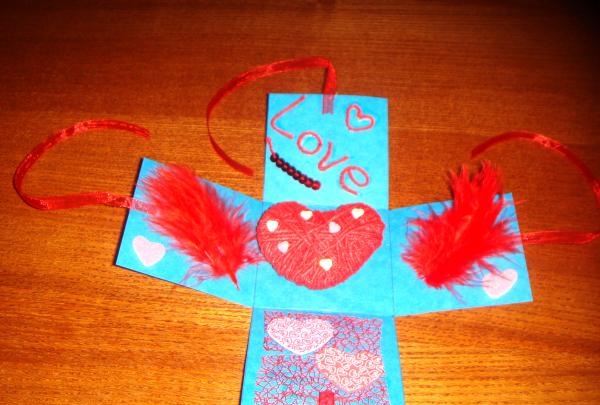 Surprise card with a heart made of threads