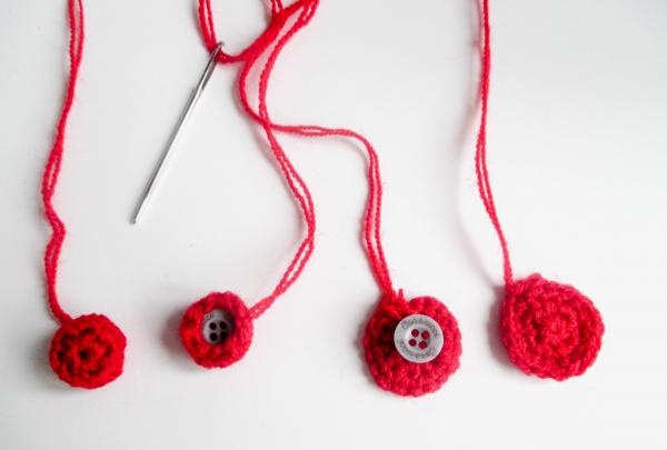 tie the buttons with red yarn