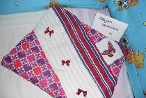 Patchwork style pillowcase with embroidery elements