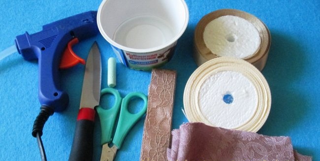 Basket made from a jar of sour cream and satin ribbons