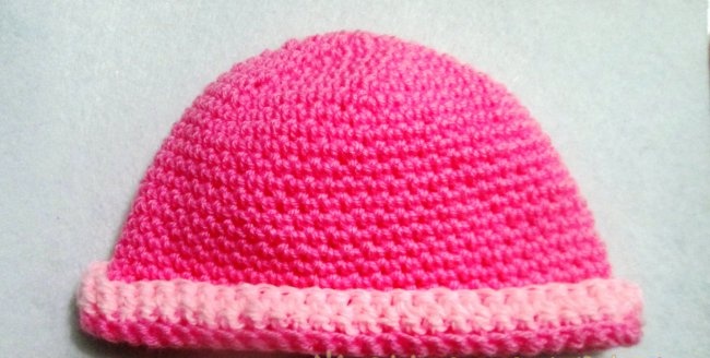 Crochet hat with a bow for a baby