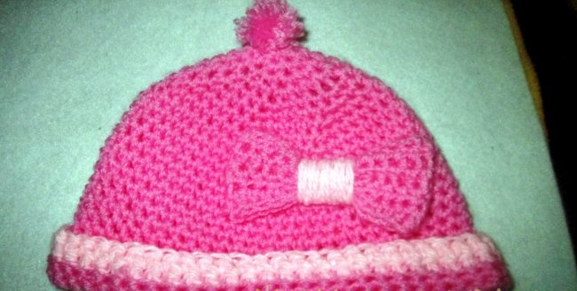 Crochet hat with a bow for a baby