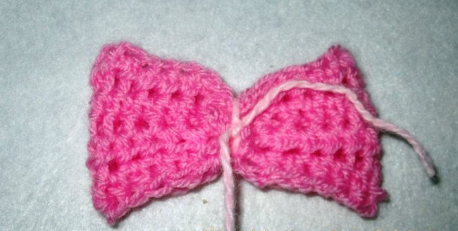 Crochet hat with a bow for a baby