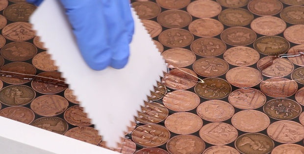 Coin floor under epoxy resin