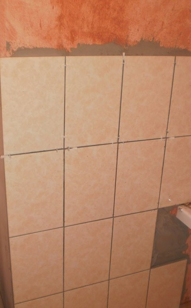 Laying tiles on walls and floors