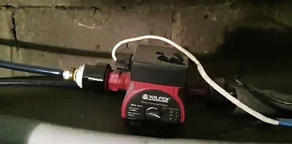 Garage heating system using gas boiler exhaust from home