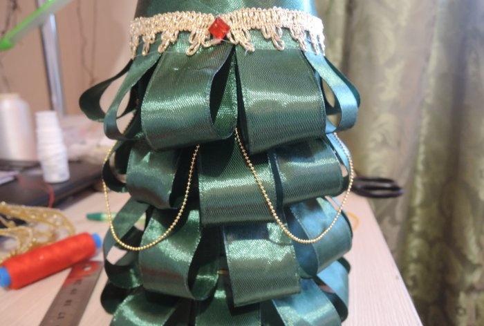 Champagne dressed up as a Christmas tree for the New Year's table