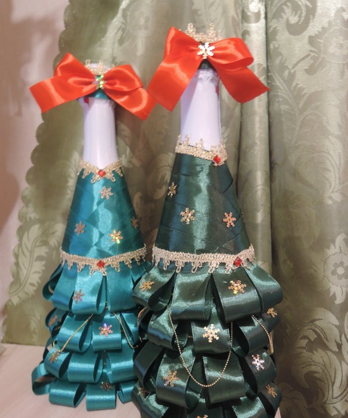 Champagne dressed up as a Christmas tree for the New Year's table