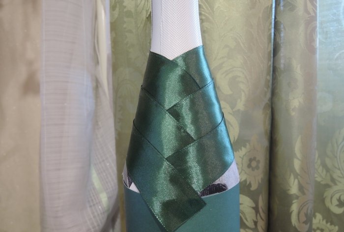 Champagne dressed up as a Christmas tree for the New Year's table