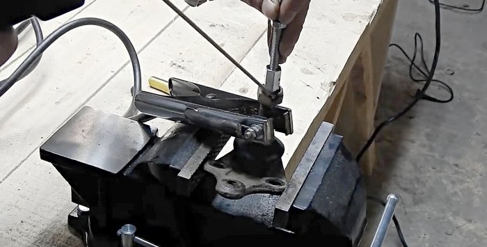 Movable bracket for attaching an angle grinder from a ball joint