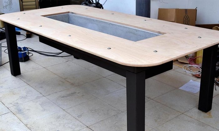 Homemade table with built-in barbecue